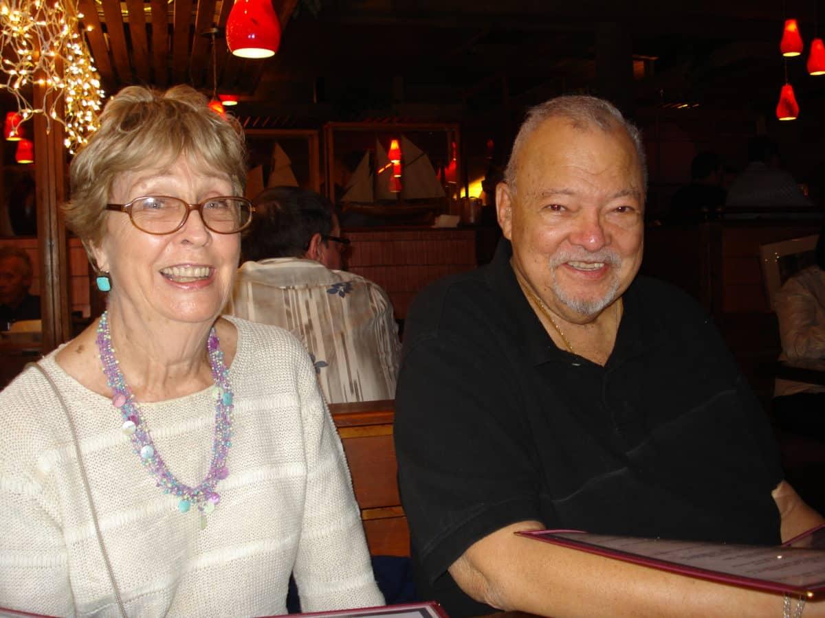 Betty and Bill Tillar smiling in a cozy restaurant setting.