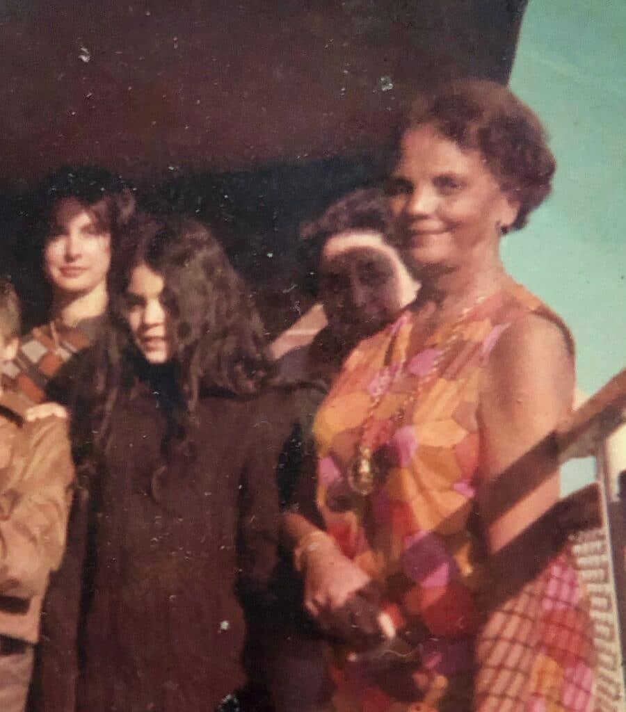 Evelyn Tillar on her apartment terrace with members of her family.