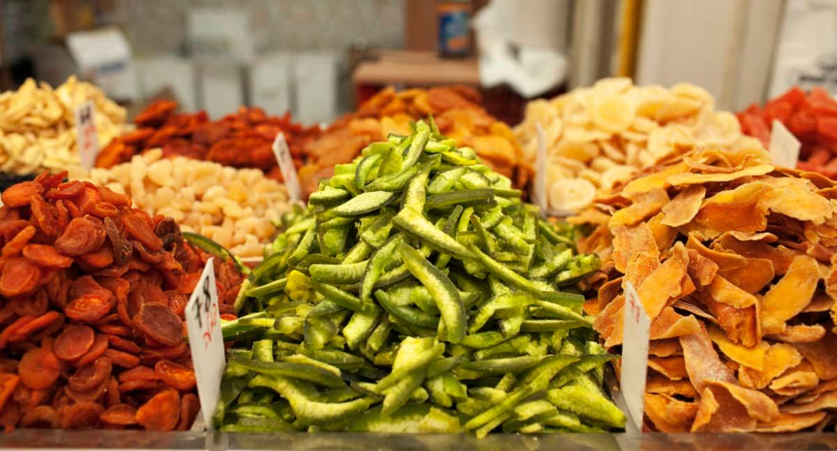 piles of dried food on display at a market