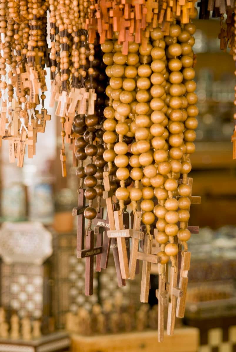 display of hanging wooded and beaded crosses