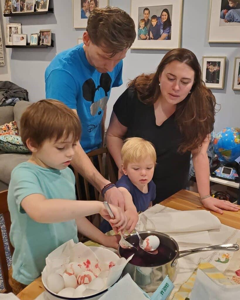 Greek family dying Easter Eggs